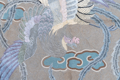 A Japanese embroidered wool and silk wall tapestry with two phoenixes, Meiji, 19th C.