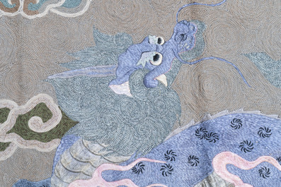 A Japanese embroidered wool and silk wall tapestry with a dragon and qilin, Meiji, 19th C.