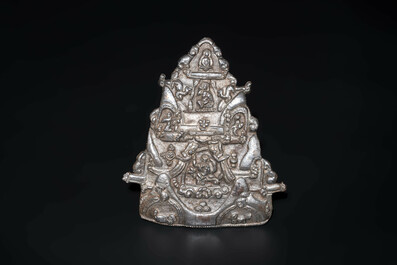 Four Tibetan bronze and wooden phurbas, a 'kapala' or skull-bowl and two silver ornaments, 19th C.