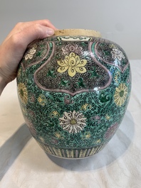 A Chinese verte biscuit 'lotus scroll' jar with wooden cover, Qing