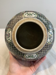 A Chinese verte biscuit 'lotus scroll' jar with wooden cover, Qing