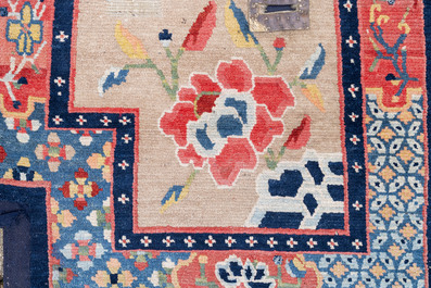 Two Tibetan saddle rugs with floral design, 19th C.