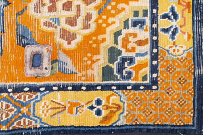 Two Tibetan saddle rugs with floral design, 19th C.