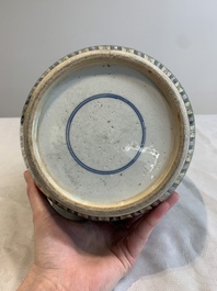 A Chinese verte biscuit 'lotus scroll' jar with wooden cover, Qing