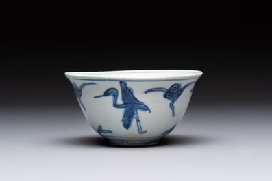 Four Chinese blue and white bowls, two cups and a plate, Ming