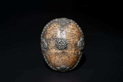 Four Tibetan bronze and wooden phurbas, a 'kapala' or skull-bowl and two silver ornaments, 19th C.