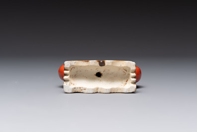 Six Chinese porcelain and glass brush rests, 19/20th C.