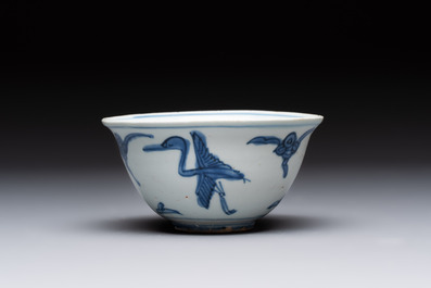 Four Chinese blue and white bowls, two cups and a plate, Ming