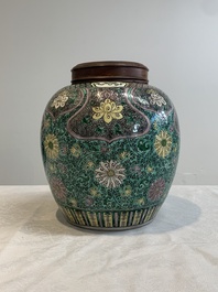 A Chinese verte biscuit 'lotus scroll' jar with wooden cover, Qing