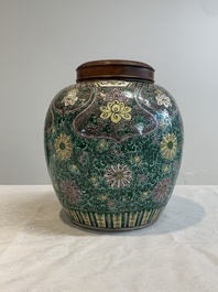 A Chinese verte biscuit 'lotus scroll' jar with wooden cover, Qing