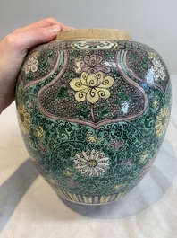 A Chinese verte biscuit 'lotus scroll' jar with wooden cover, Qing