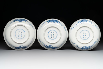 11 Japanese blue and white cups and 12 saucers with floral design, Chenghua mark, Meiji, 19th C.