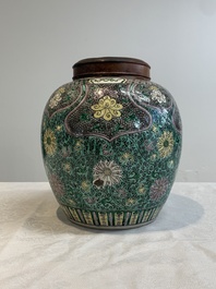A Chinese verte biscuit 'lotus scroll' jar with wooden cover, Qing