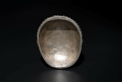 Four Tibetan bronze and wooden phurbas, a 'kapala' or skull-bowl and two silver ornaments, 19th C.