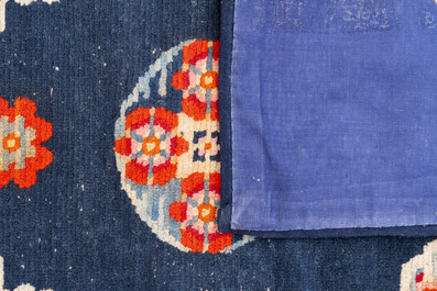 Two Tibetan saddle rugs and three small rugs, 19th C.