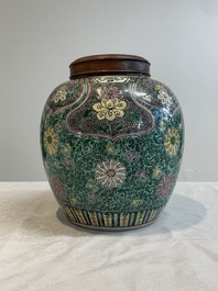 A Chinese verte biscuit 'lotus scroll' jar with wooden cover, Qing