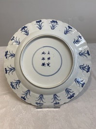 A Chinese blue and white 'heightened medallion' dish and a 'hunting' dish, Chenghua mark, Kangxi/Yongzheng