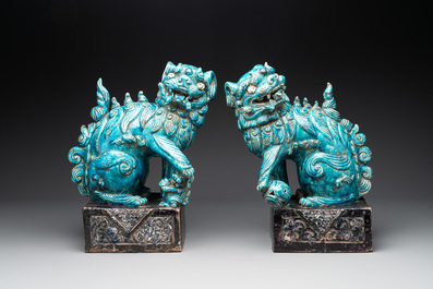 A pair of Chinese turquoise-and-aubergine-glazed Buddhist lions, probably Swatow kilns, 19th C.