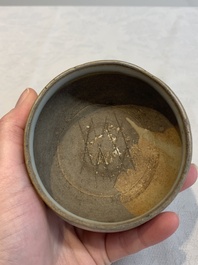 A Chinese 'jun' bowl and a Dehua blanc de Chine group with Guanyin, Ming/Qing
