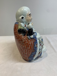 A Chinese famille rose black-ground covered vase and a famille rose Milefo Buddha, Mao Ji Sheng 茂記生造 mark, 19/20th C.