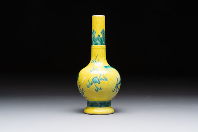 A Chinese wucai 'flying horse' jar, a green-enamelled yellow-ground 'dragon' vase and a Nanking crackle-glazed jar, 19th C.