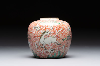 A Chinese wucai 'flying horse' jar, a green-enamelled yellow-ground 'dragon' vase and a Nanking crackle-glazed jar, 19th C.