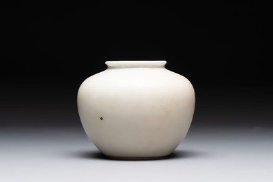 A Chinese wucai 'flying horse' jar, a green-enamelled yellow-ground 'dragon' vase and a Nanking crackle-glazed jar, 19th C.