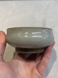 A Chinese 'jun' bowl and a Dehua blanc de Chine group with Guanyin, Ming/Qing