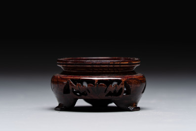 Two Chinese monochrome vases and a water pot on wooden stand, 19/20th C.