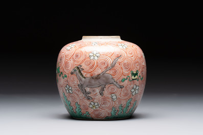 A Chinese wucai 'flying horse' jar, a green-enamelled yellow-ground 'dragon' vase and a Nanking crackle-glazed jar, 19th C.