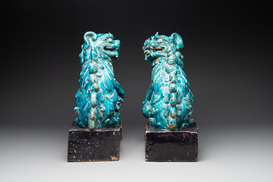 A pair of Chinese turquoise-and-aubergine-glazed Buddhist lions, probably Swatow kilns, 19th C.