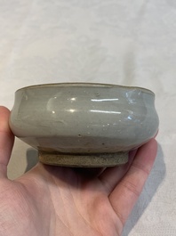 A Chinese 'jun' bowl and a Dehua blanc de Chine group with Guanyin, Ming/Qing