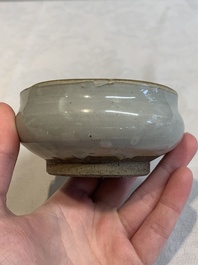A Chinese 'jun' bowl and a Dehua blanc de Chine group with Guanyin, Ming/Qing