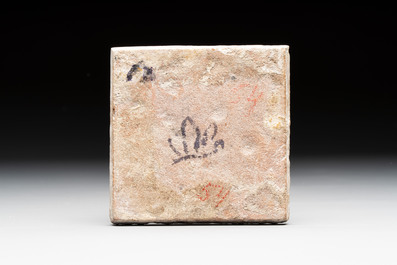 A polychrome Dutch Delft maiolica 'dog' diamond tile, late 16th C.