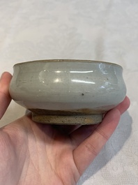 A Chinese 'jun' bowl and a Dehua blanc de Chine group with Guanyin, Ming/Qing