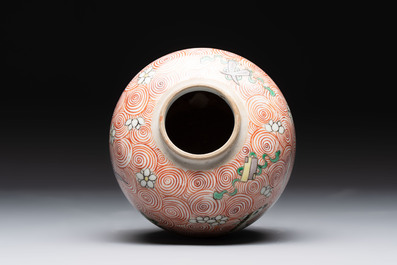 A Chinese wucai 'flying horse' jar, a green-enamelled yellow-ground 'dragon' vase and a Nanking crackle-glazed jar, 19th C.