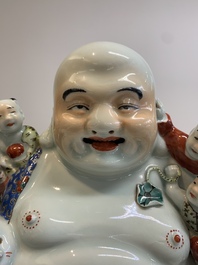 A Chinese famille rose black-ground covered vase and a famille rose Milefo Buddha, Mao Ji Sheng 茂記生造 mark, 19/20th C.