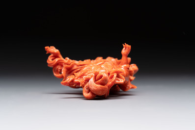 A Chinese red coral figure of a goddess on wooden stand, 19/20th C.