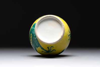 A Chinese wucai 'flying horse' jar, a green-enamelled yellow-ground 'dragon' vase and a Nanking crackle-glazed jar, 19th C.