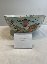 A large Chinese famille rose punch bowl with flowering and fruiting branches, Qianlong