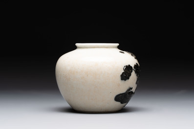 A Chinese wucai 'flying horse' jar, a green-enamelled yellow-ground 'dragon' vase and a Nanking crackle-glazed jar, 19th C.