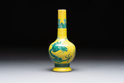 A Chinese wucai 'flying horse' jar, a green-enamelled yellow-ground 'dragon' vase and a Nanking crackle-glazed jar, 19th C.