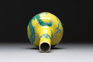 A Chinese wucai 'flying horse' jar, a green-enamelled yellow-ground 'dragon' vase and a Nanking crackle-glazed jar, 19th C.