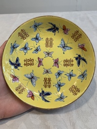 A Chinese famille rose yellow-ground 'butterfly' plate and a saucer with floral design, Guangxu mark, 19/20th C.