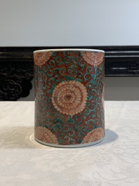 A Chinese famille verte coral-red-ground 'chrysanthemum scroll' brush pot, Kangxi