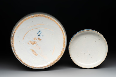 A rare large blue and white Dutch Delft albarello with original cover, 18th C.