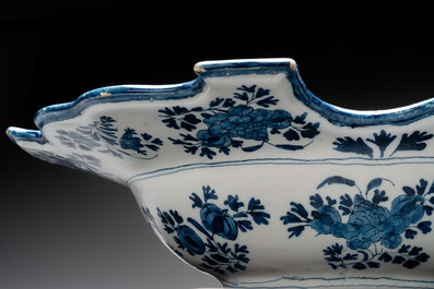 A very rare and large blue and white Dutch Delft double barber's bowl with floral design, late 17th C.