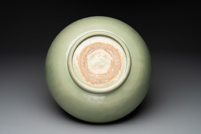 A Chinese Longquan celadon bowl with 'anhua' floral design, Ming