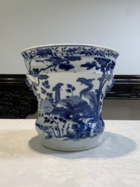 A pair of Chinese blue and white 'birds among flowering branches' jardini&egrave;res, 19th C.