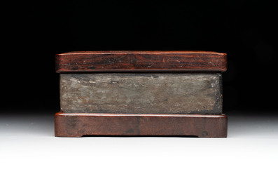 Two Chinese carved bamboo brush pots and an ink stone with wooden cover and stand, signed He Xuanting 何選廷 and Dian Liangbi 典良弼, 19th C.